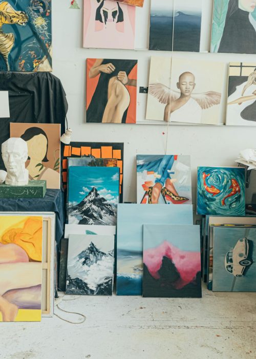 pexels-photo-4442074-4442074 A vibrant art studio featuring diverse paintings, sculptures, and artistic materials in an indoor setting.